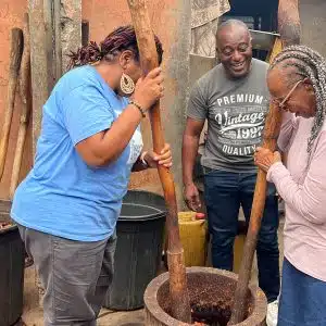 Stephanie and BEtty Practising Batik Making by pounding the wool for the design